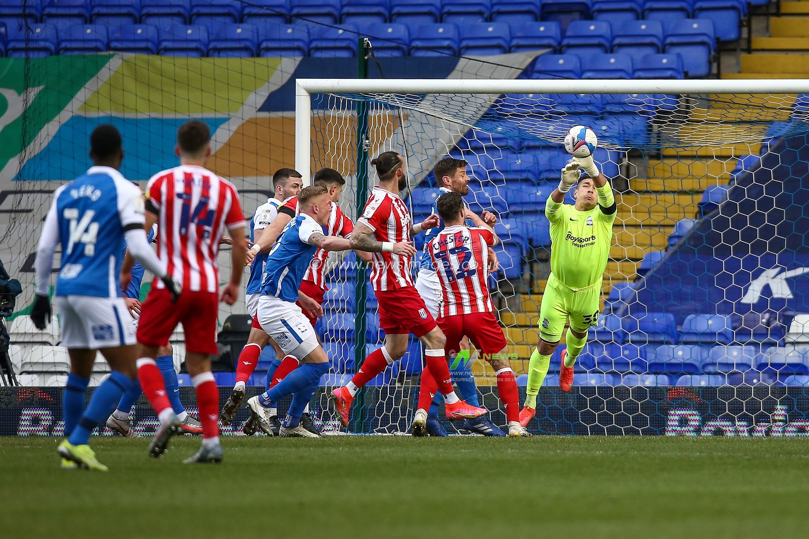 Neil Etheridge #30 of Birmingham City clears the ball following a corner