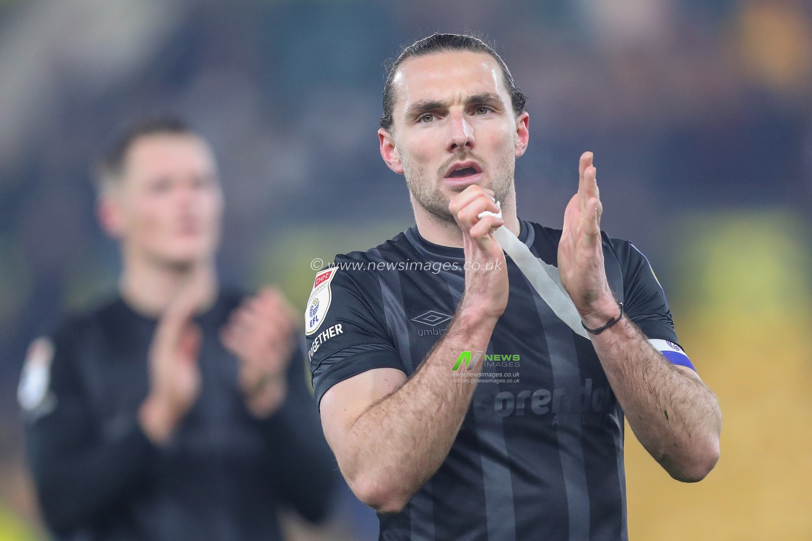 Lewis Coyle #2 of Hull City applauds the travelling fans after the Sky Bet Championship match Norwich City vs Hull City at Carrow Road, Norwich, United Kingdom, 14th February 2023

(Photo by Gareth Evans/News Images)