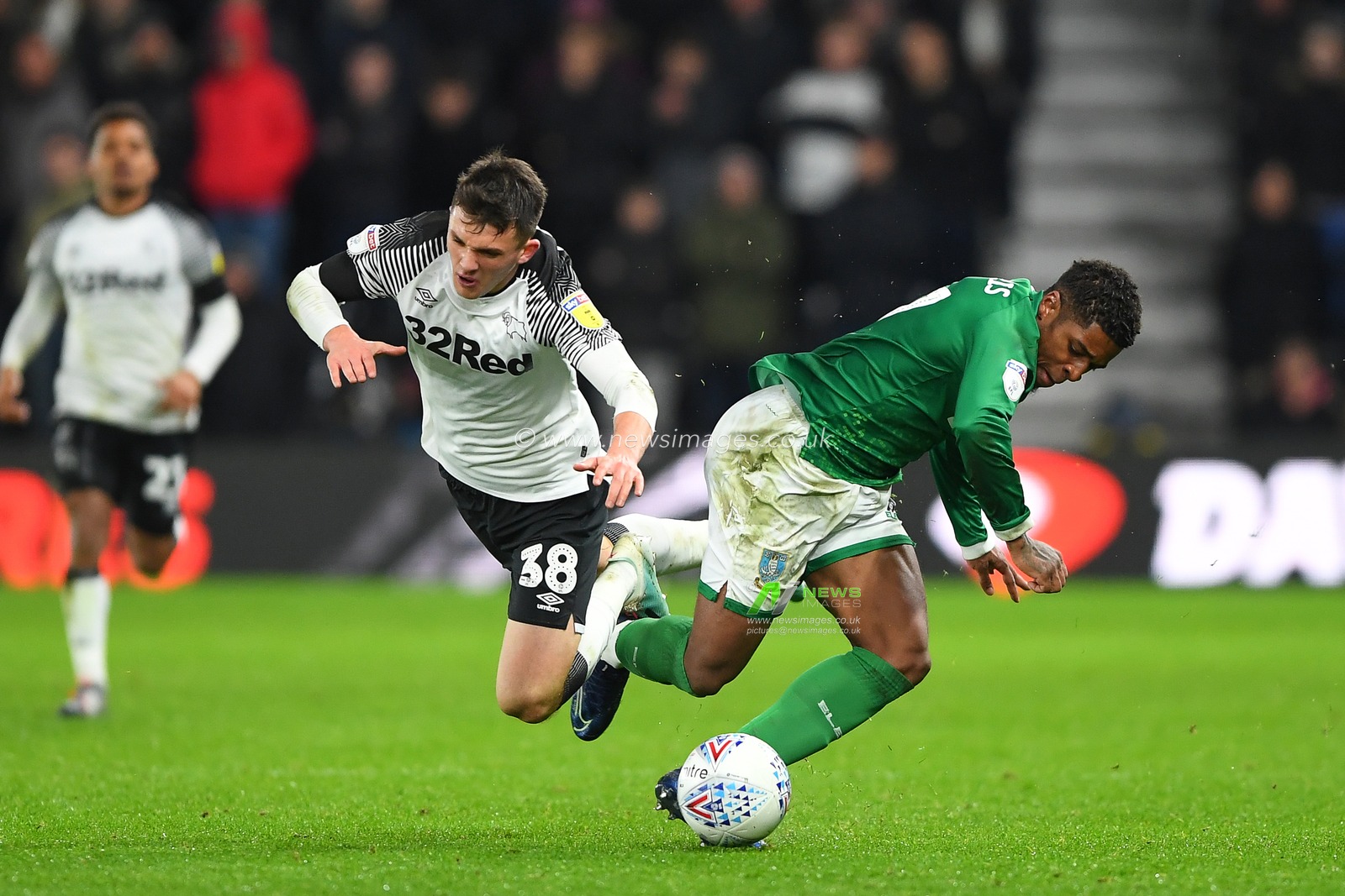 11th December 2019, Pride Park Stadium, Derby, England; Sky Bet Championship, Derby County v Sheffield Wednesday : Jason Knight (38) of Derby County tackles Kadeem Harris (7) of Sheffield Wednesday 

Credit: Jon Hobley/News Images