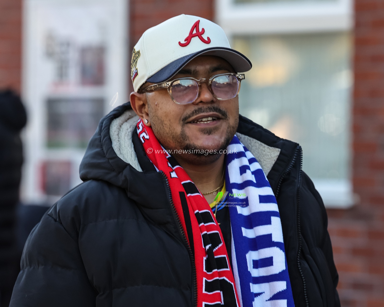 A fan with half and half scarf on during the Premier League match Manchester United vs Brighton and Hove Albion at Old Trafford, Manchester, United Kingdom, 25th October 2025

(Photo by Mark Cosgrove/News Images)