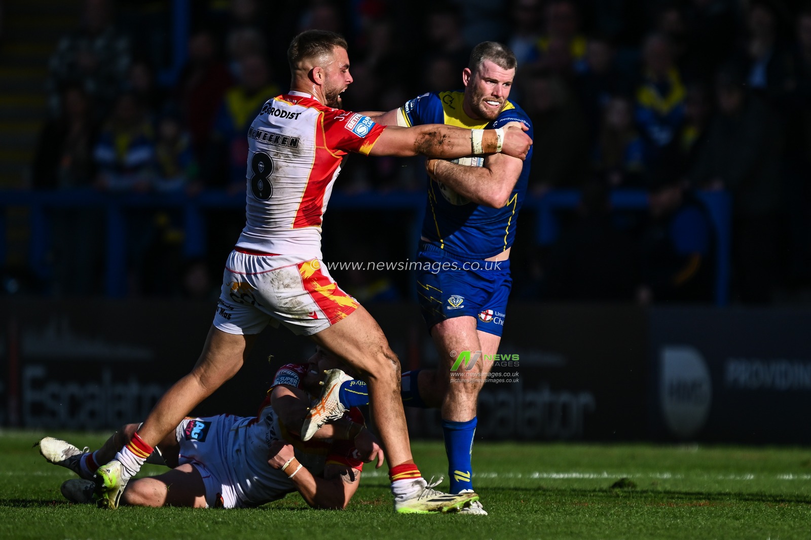 Lachlan Fitzgibbon of Warrington Wolves breaks free from the tackle of Ugo Tison of Catalan Dragons and Mike McMeeken of Catalan Dragons during the Betfred Super League match Warrington Wolves vs Catalans Dragons at Halliwell Jones Stadium, Warrington, United Kingdom, 30th March 2024

(Photo by Craig Thomas/News Images)