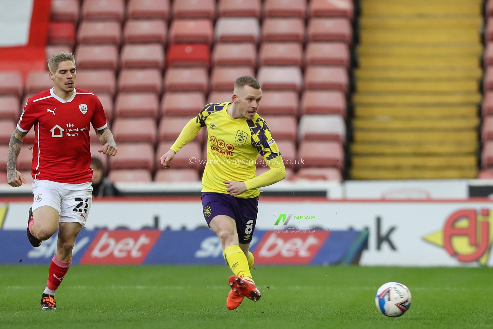 Lewis Oâ€™Brien #8 of Huddersfield Town â€œpasses the ball