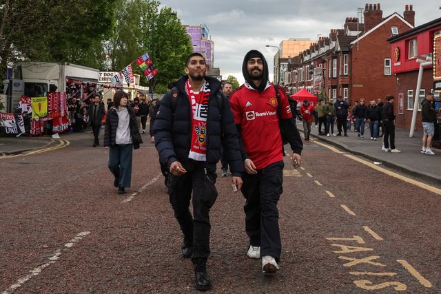 Manchester United fans make their way to Old Trafford during the Premier League match Manchester United vs Brentford at Old Trafford, Manchester, United Kingdom on 27 April 2026

(Photo by Mark Cosgrove/News Images)