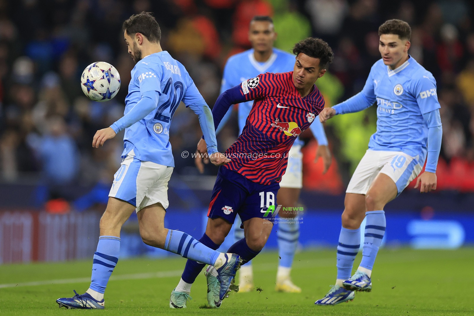 Bernardo Silva #20 of Manchester City takes the ball from Fabio Carvalho #18 of RB Leipzig during the UEFA Champions League Group G match Manchester City vs RB Leipzig at Etihad Stadium, Manchester, United Kingdom, 28th November 2023

(Photo by Conor Molloy/News Images)