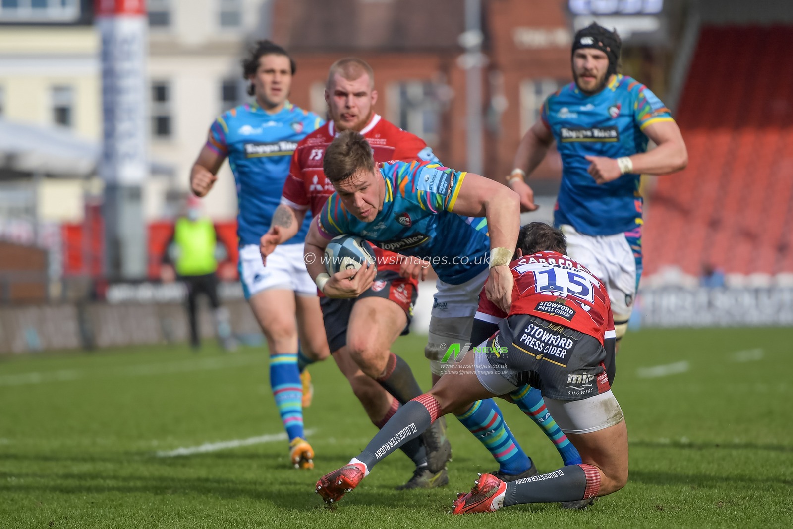 santiago carreras #15 of gloucester rugby tackles Hanro Liebenberg #8 of Leicester Tigers