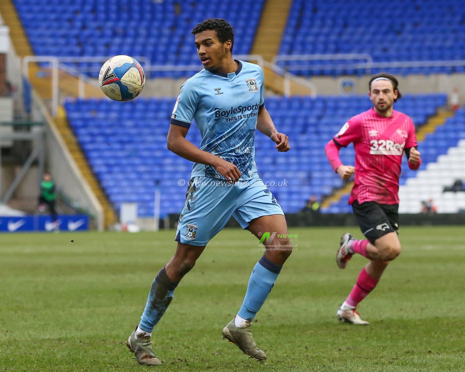 Sam McCallum #21 of Coventry City keeps his eyes on the ball