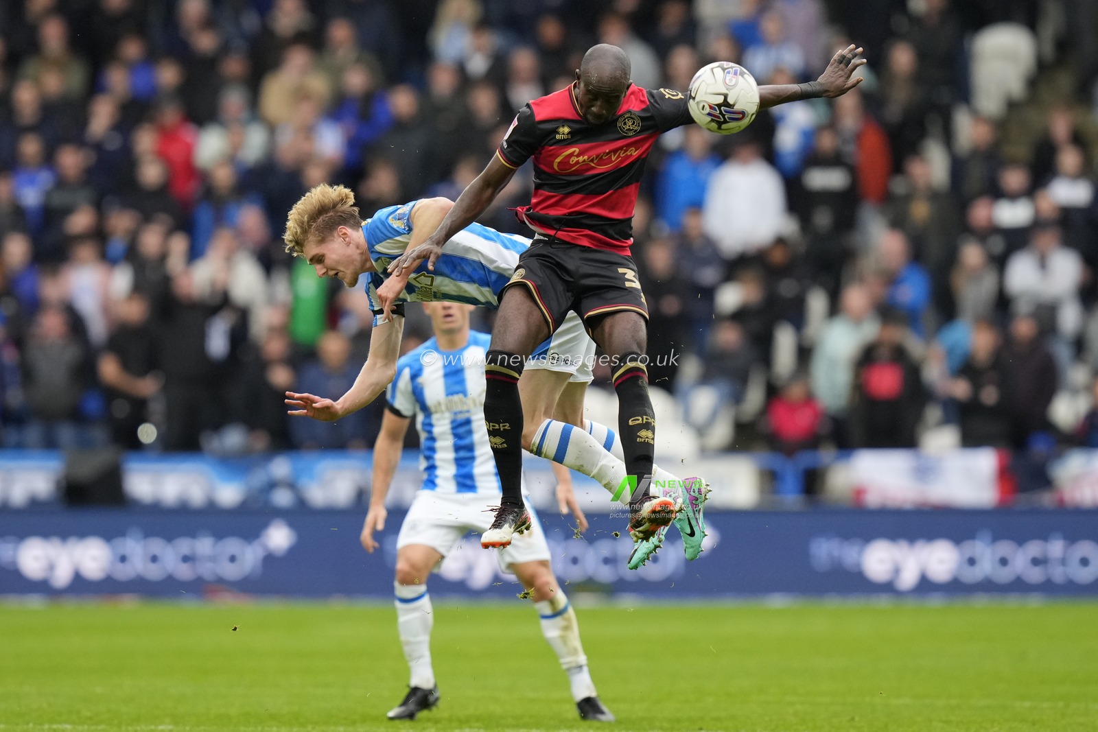 Jack Rudoni #8 of Huddersfield Town competes for a header with Albert Adomah #37 of Queens Park Rangers during the Sky Bet Championship match Huddersfield Town vs Queens Park Rangers at John Smith's Stadium, Huddersfield, United Kingdom, 21st October 2023

(Photo by Steve Flynn/News Images)