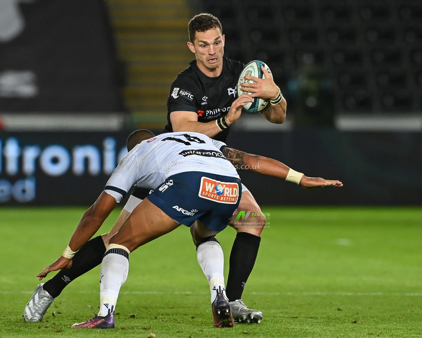George North of Ospreys is tackled by David Kriel of Vodacom Bulls