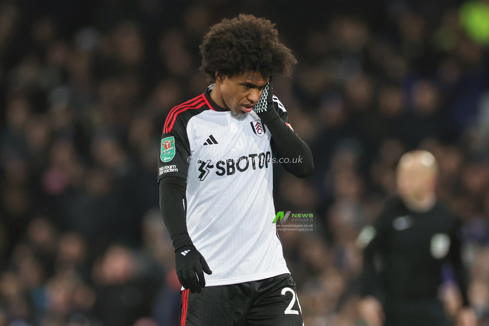 Willian of Fulham holds his face during the Carabao Cup Quarter Final match Everton vs Fulham at Goodison Park, Liverpool, United Kingdom, 19th December 2023

(Photo by Mark Cosgrove/News Images)