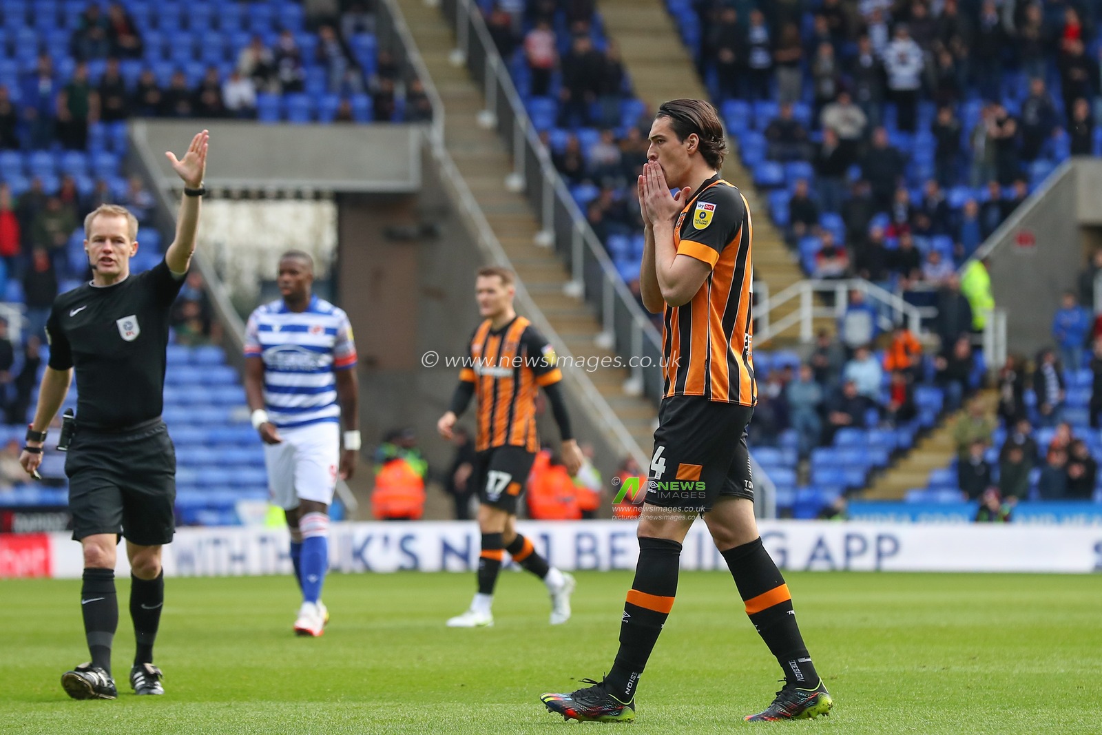Jacob Greaves #4 of Hull City reacts to Joe Lumley #1 of Reading saving a shot from Allahyar Sayyadmanesh #9 of Hull City during the Sky Bet Championship match Reading vs Hull City at Select Car Leasing Stadium, Reading, United Kingdom, 18th March 2023

(Photo by Gareth Evans/News Images)