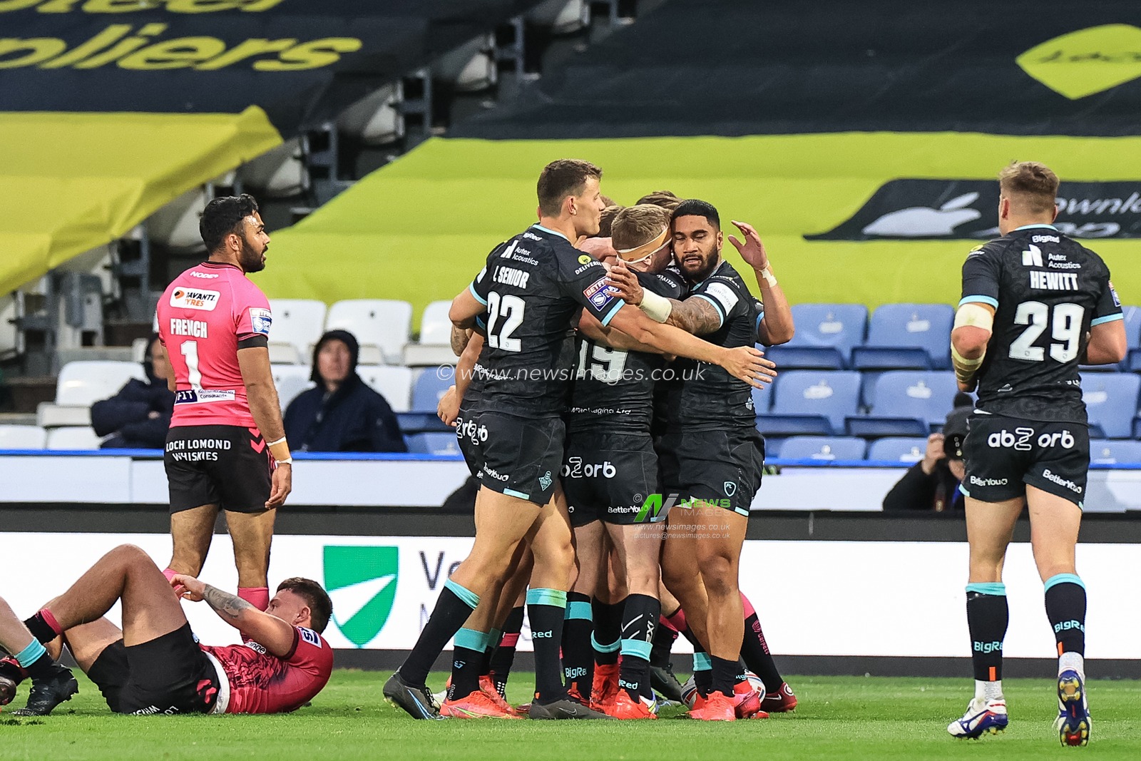 Ricky Leutele #4 of Huddersfield Giants celebrates his try