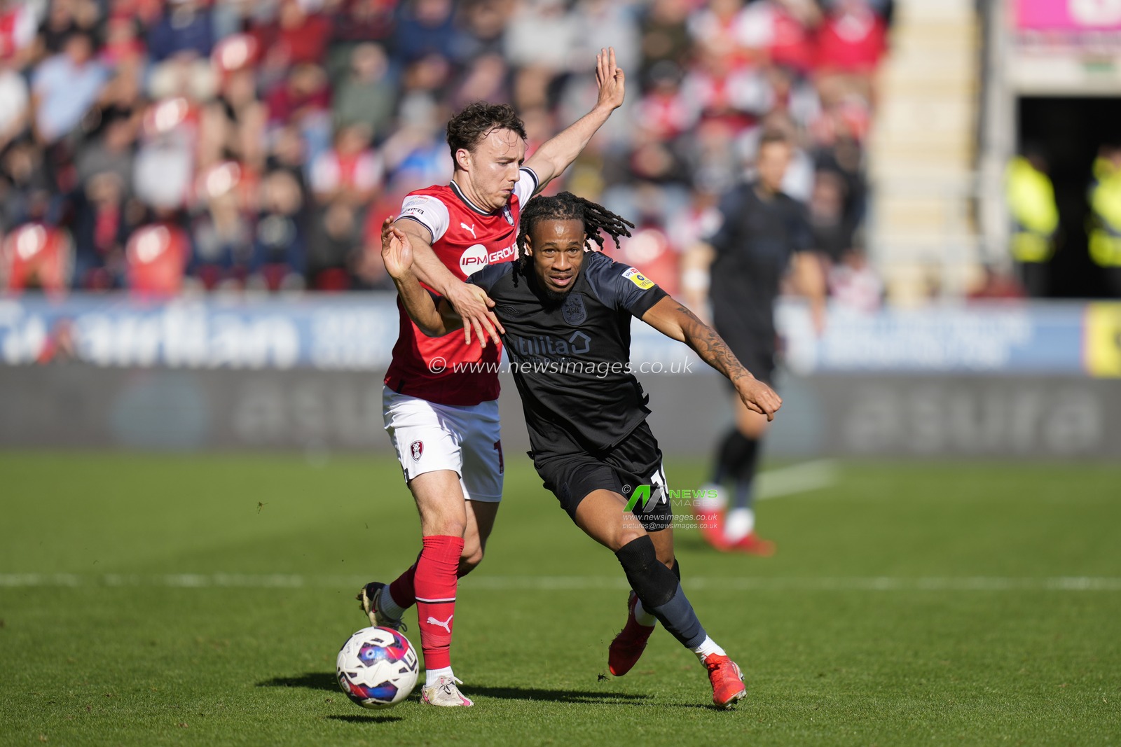 David Kasumu #18 of Huddersfield Town breaks past Ollie Rathbone #18 of Rotherham United during the Sky Bet Championship match Rotherham United vs Huddersfield Town at AESSEAL New York Stadium, Rotherham, United Kingdom, 15th October 2022

(Photo by Steve Flynn/News Images)