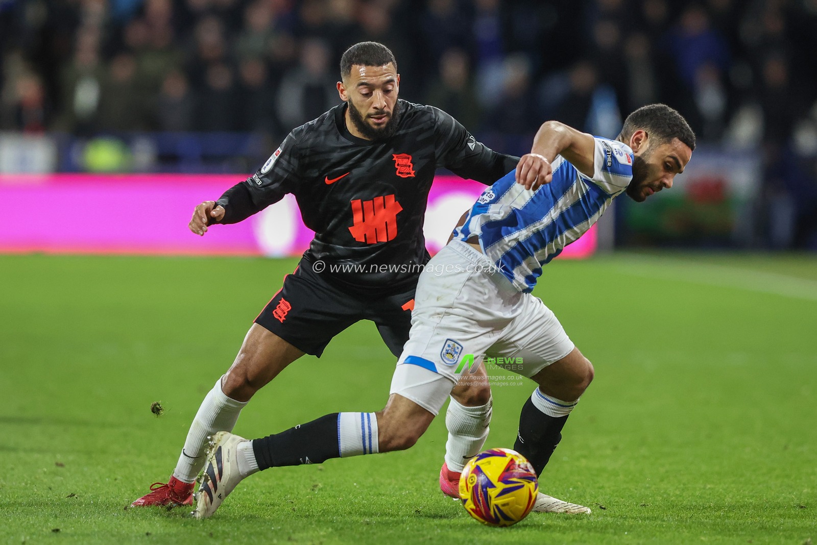 Brodie Spencer Huddersfield Town and Keshi Anderson of Birmingham City battle for the ball during the Sky Bet League 1 match Huddersfield Town vs Birmingham City at John Smith's Stadium, Huddersfield, United Kingdom, 28th January 2025

(Photo by Alfie Cosgrove/News Images)