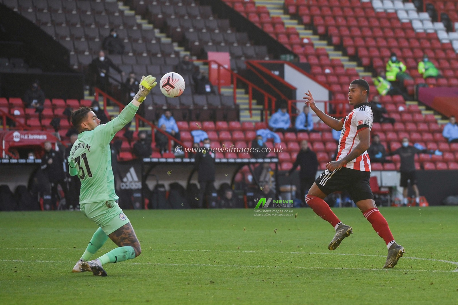 Rhian Brewster (24) of Sheffield United has a shot saved by Ederson (31) of Manchester City