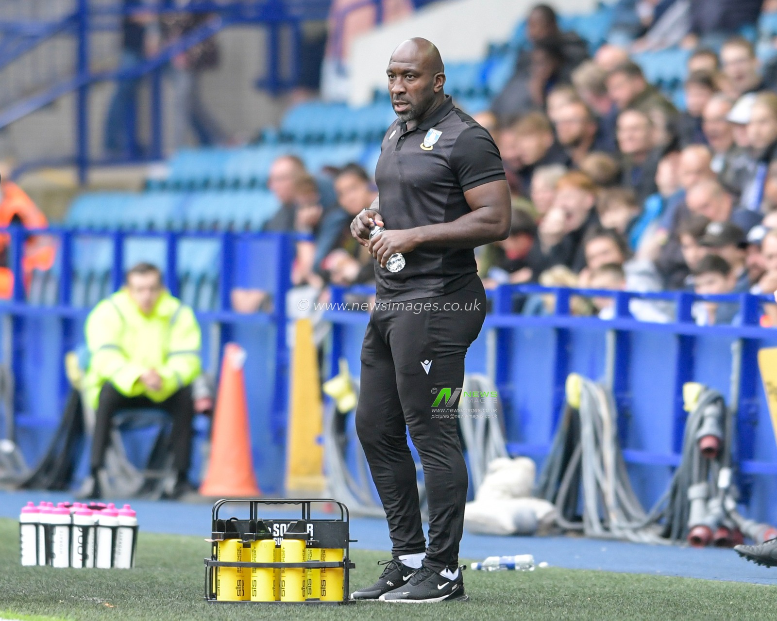 Darren Moore manager of Sheffield Wednesday watches the game from the technical area
