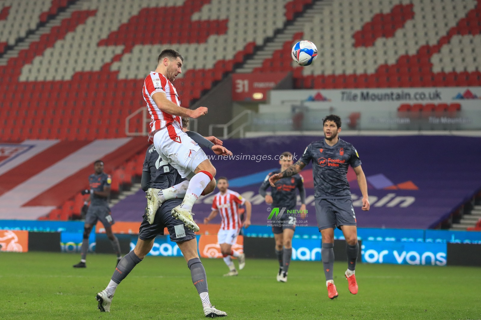 Sam Vokes #9 of Stoke City heads on goal, saved