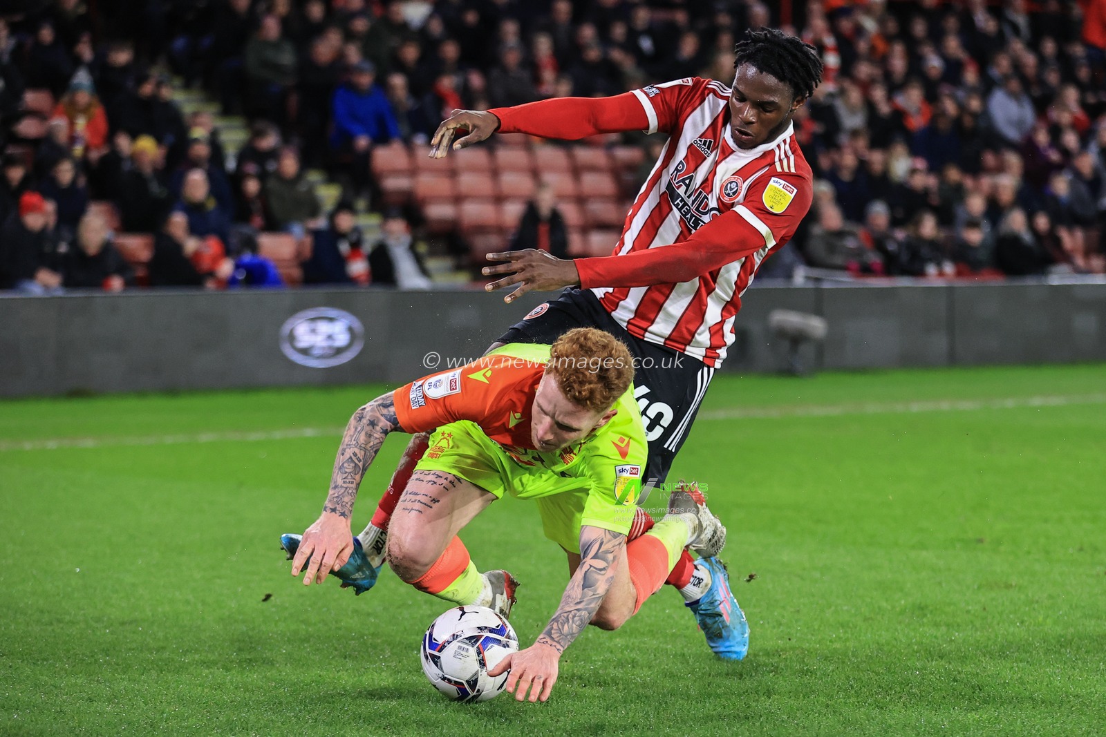 Jack Colback #8 of Nottingham Forest is fouled by Femi Seriki #40 of Sheffield United