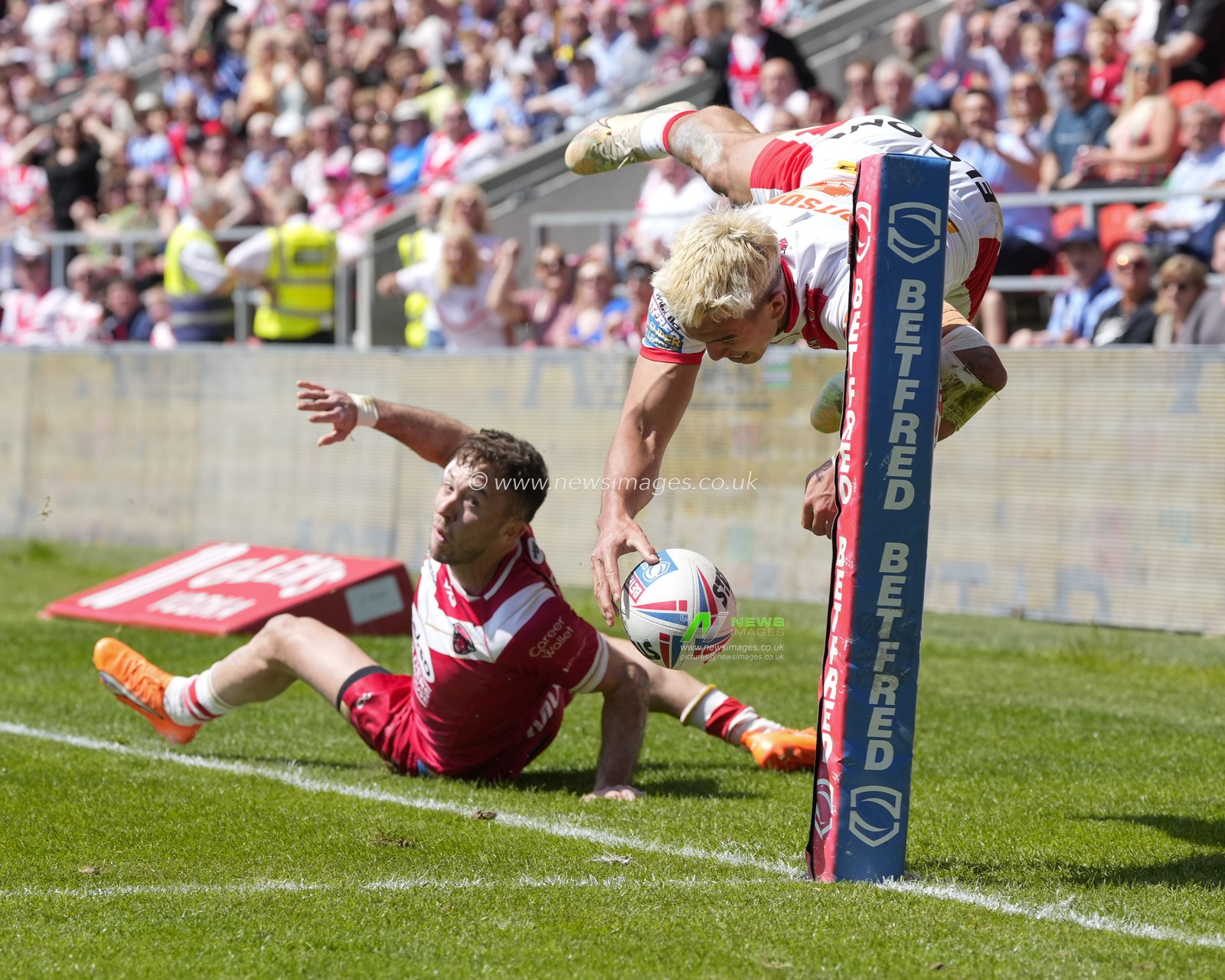 Ryan Brierley #1 of Salford Red Devils tackles Tee Ritson #25 of St. Helens as he dives for the line during the Betfred Super League Round 12 match St Helens vs Salford Red Devils at Totally Wicked Stadium, St Helens, United Kingdom, 13th May 2023

(Photo by Steve Flynn/News Images)