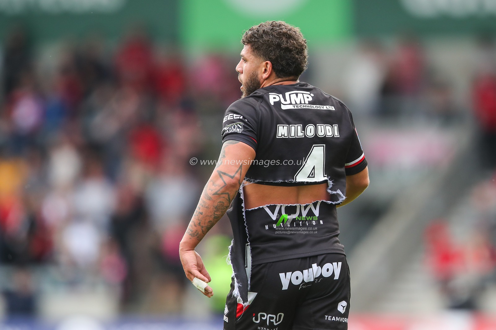 Hakim Miloudi of London Broncos shirt is ripped following a tackle by Ethan Ryan of Salford Red Devils during the Betfred Super League Round 13 match Salford Red Devils vs London Broncos at Salford Community Stadium, Eccles, United Kingdom, 2nd June 2024

(Photo by Gareth Evans/News Images)