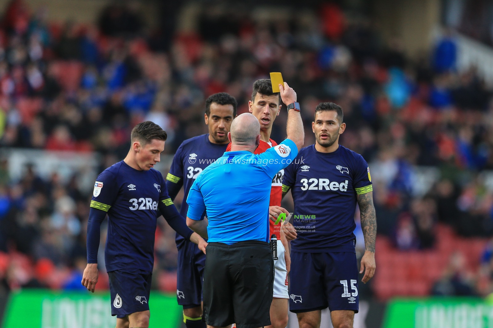 27th October 2018, Riverside Stadium, Middlesbrough, England ; Sky Bet Championship Middlesbrough v Derby ; referee Simon Hooper gives a yellow card to Daniel Ayala (04) of Middlesbrough 

Credit: Mark Cosgrove/News Images

English Football League images are subject to DataCo Licence