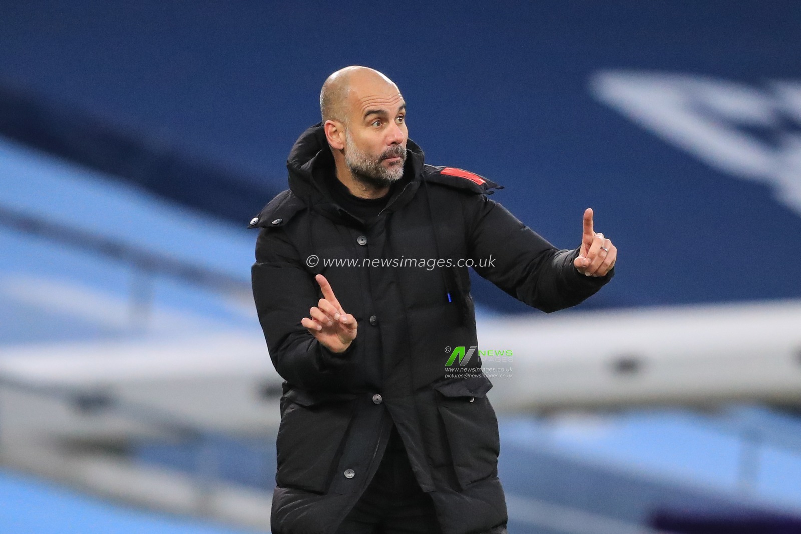 Josep Guardiola manager of Manchester City reacts during the game