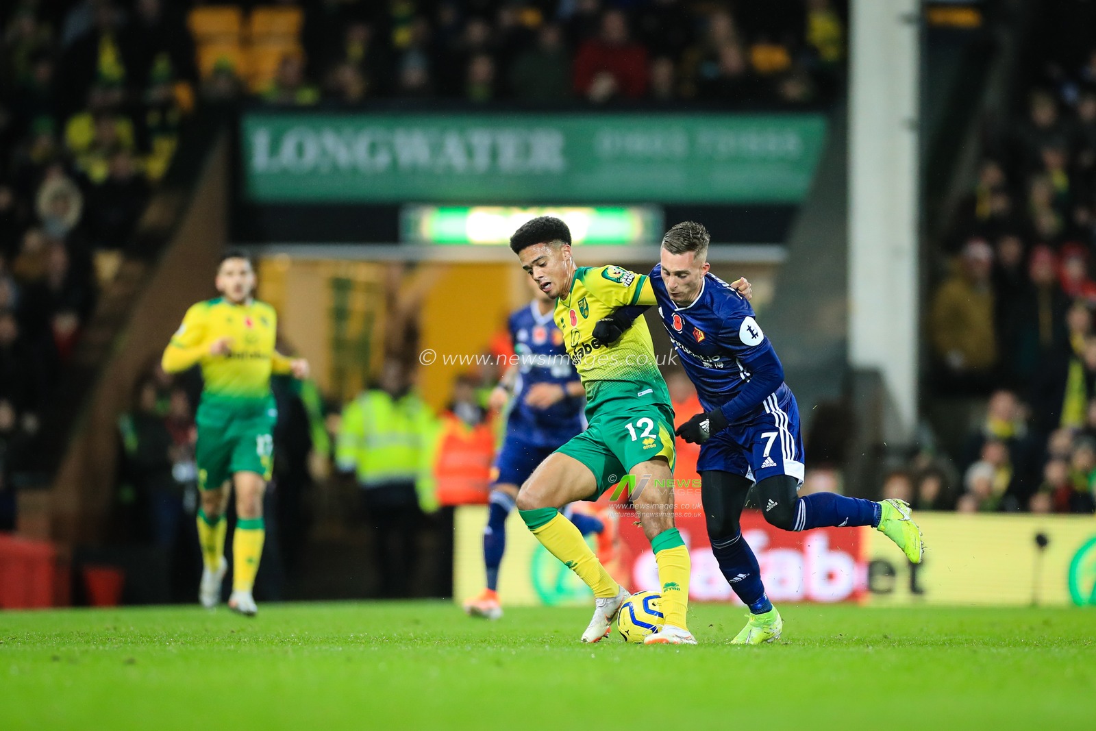 8th November 2019, Carrow Road, Norwich, England; Premier League, Norwich City v Watford : Jamal Lewis (12) of Norwich City and Gerard Deulofeu (07) of Watford tussle for the ball

Credit: Georgie Kerr/News Images