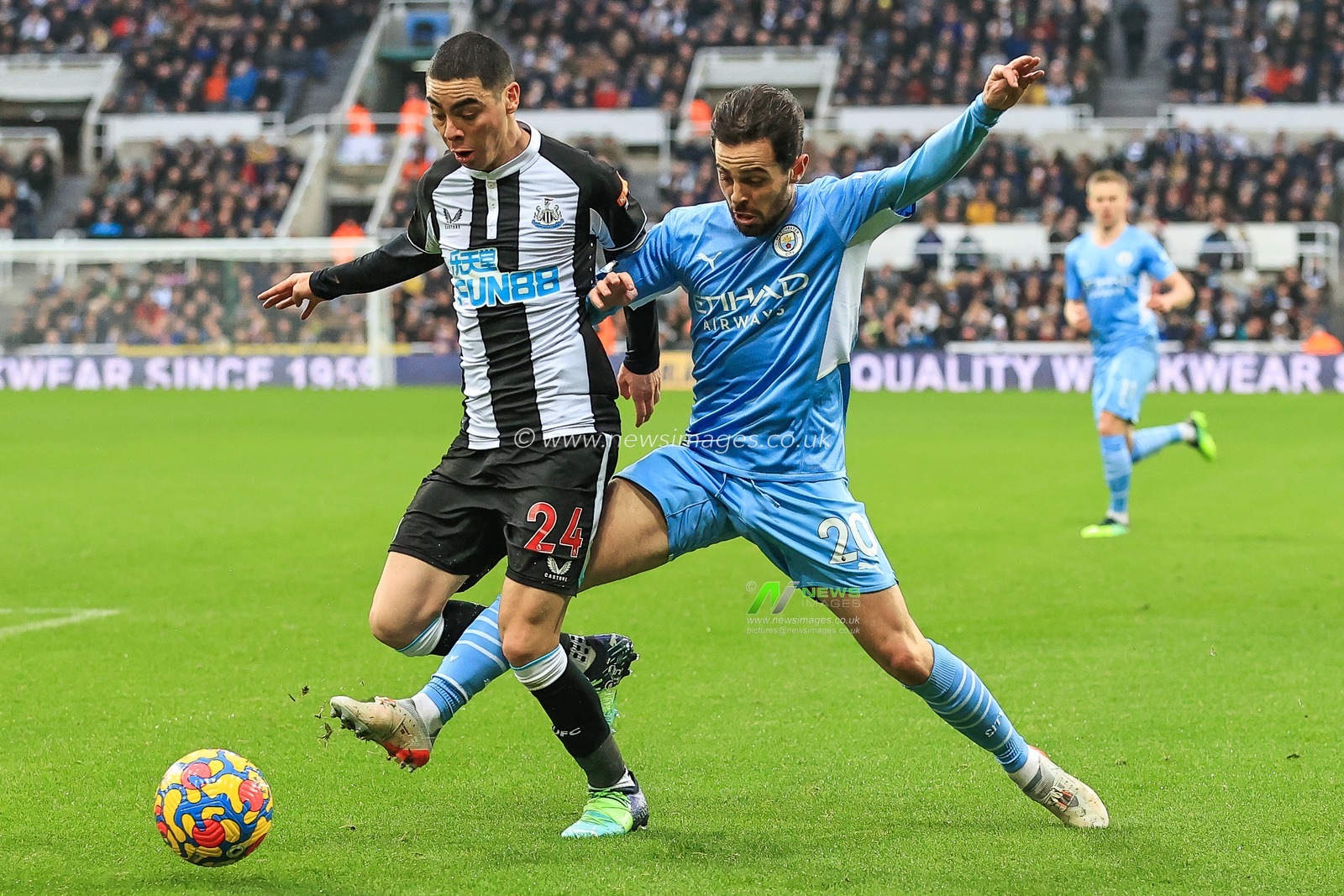 Miguel Almiron #24 of Newcastle United and Bernardo Silva #20 of Manchester City battles for the ball
