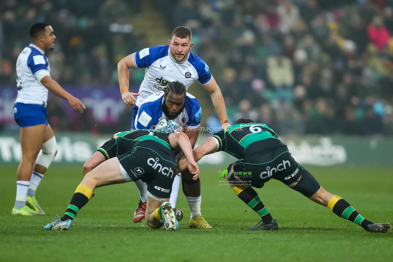 Beno Obano of Bath Rugby is tackled by Curtis Langdon and Josh Kemeny of Northampton Saints during the Gallagher Premiership match Northampton Saints vs Bath Rugby at Cinch Stadium at Franklin's Gardens, Northampton, United Kingdom, 5th January 2025

(Photo by Izzy Poles/News Images)