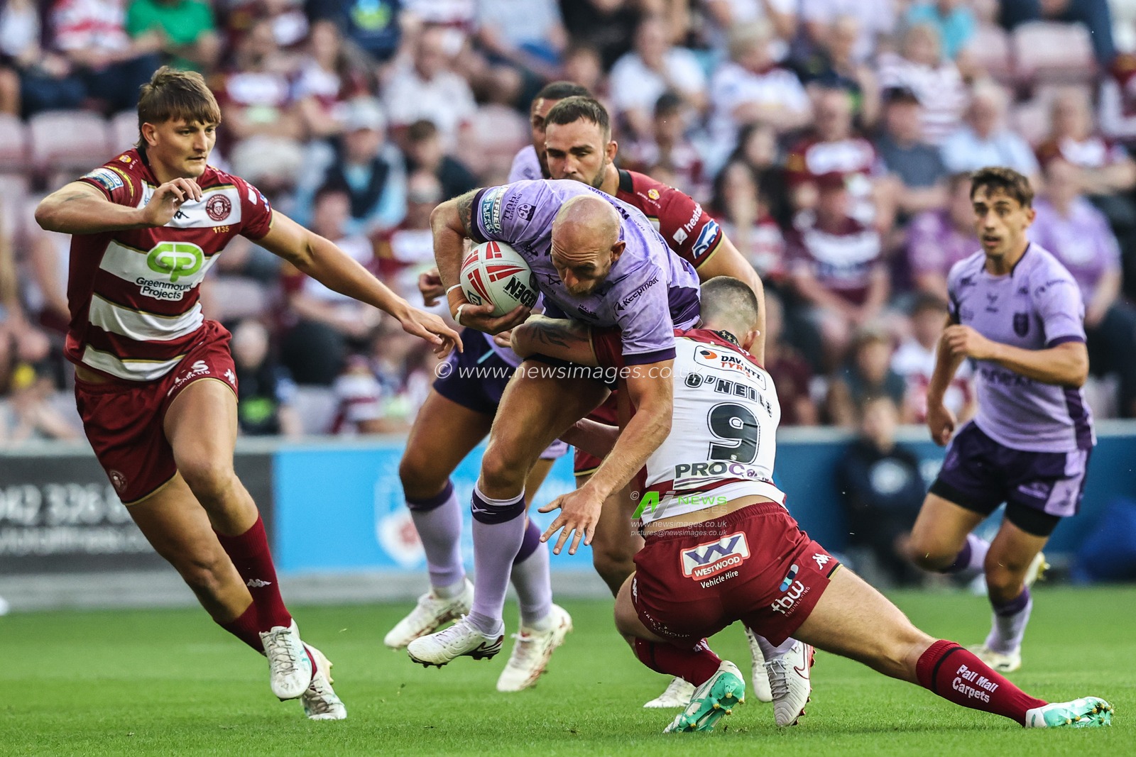 Dean Hadley of Hull KR is tackled during the Betfred Super League round 22 match Wigan Warriors vs Hull KR at The Brick Community Stadium, Wigan, United Kingdom, 15th August 2025

(Photo by Alfie Cosgrove/News Images)