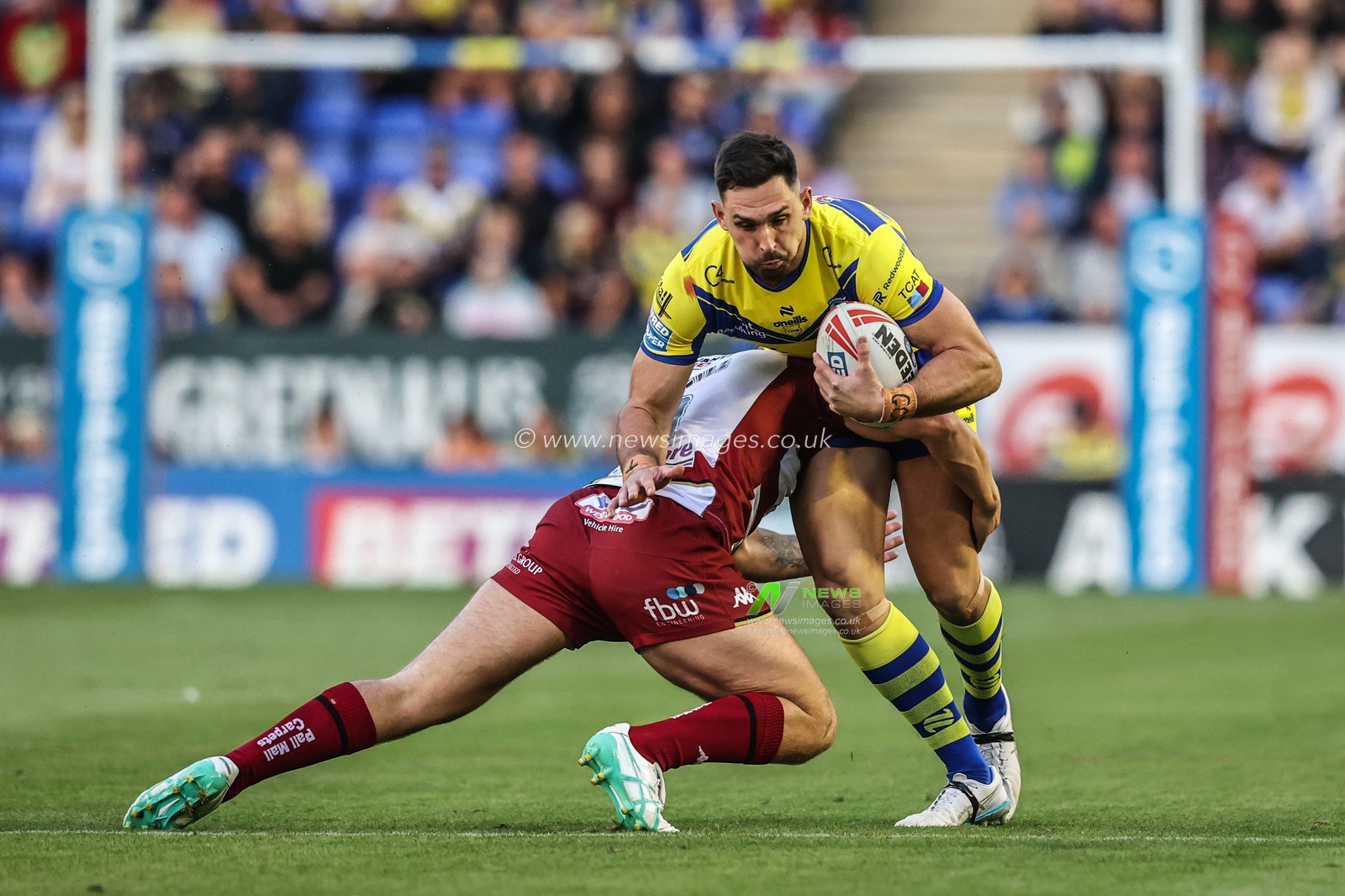 Ryan Matterson of Warrington Wolves is tackled during the Betfred Super League round 21 match Warrington Wolves vs Wigan Warriors at Halliwell Jones Stadium, Warrington, United Kingdom, 8th August 2025

(Photo by Alfie Cosgrove/News Images)