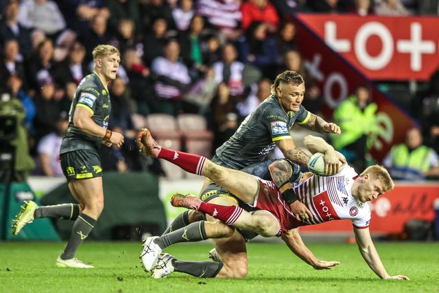Zach Eckersley of Wigan Warriors is tackled by Danny Levi of Leeds Rhinos during the Betfred Super League round 11 match Wigan Warriors vs Leeds Rhinos at The Brick Community Stadium, Wigan, United Kingdom on 15 May 2026

(Photo by Alfie Cosgrove/News Images)