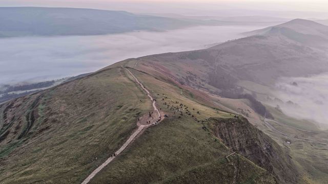 Sunrise hikers walk to the summit of Mam Tor as they watch the sunrise and admire the cloud inversion in the Hope Valley at Mam Tor in the Peak District at Mam Tor, Castleton, United Kingdom on 21 March 2026

(Photo by Mark Cosgrove/News Images)