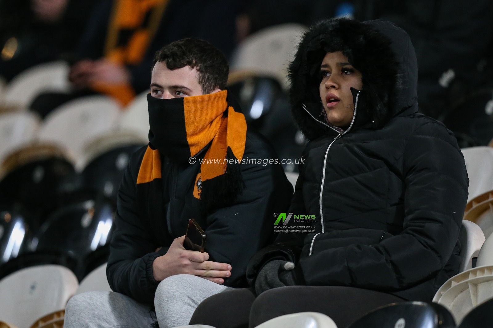 Hull City fans wrap up warm and wait for the kick off