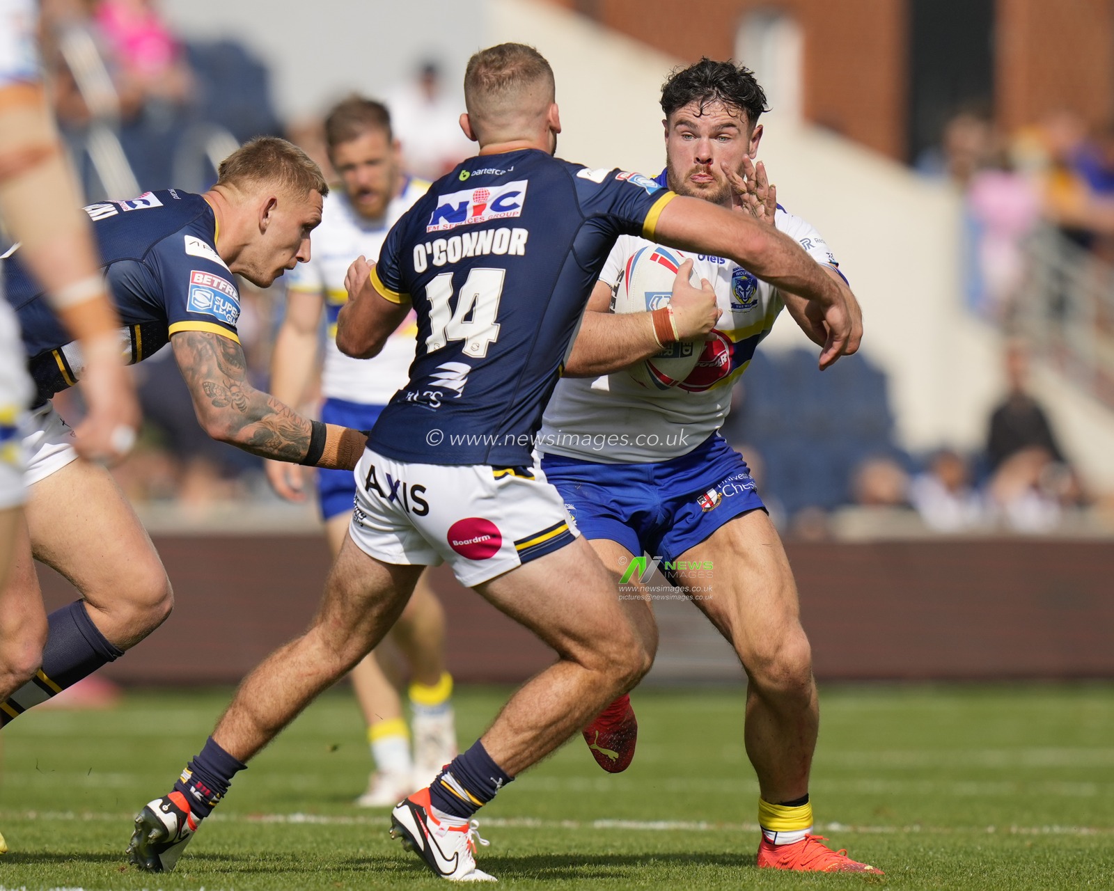 Joe Philbin #15 of Warrington Wolves runs at Jarrod Oâ€™Connor #14 of Leeds Rhinos during the Betfred Super League Round 22 match Leeds Rhinos vs Warrington Wolves at Headingley Stadium, Leeds, United Kingdom, 20th August 2023

(Photo by Steve Flynn/News Images)