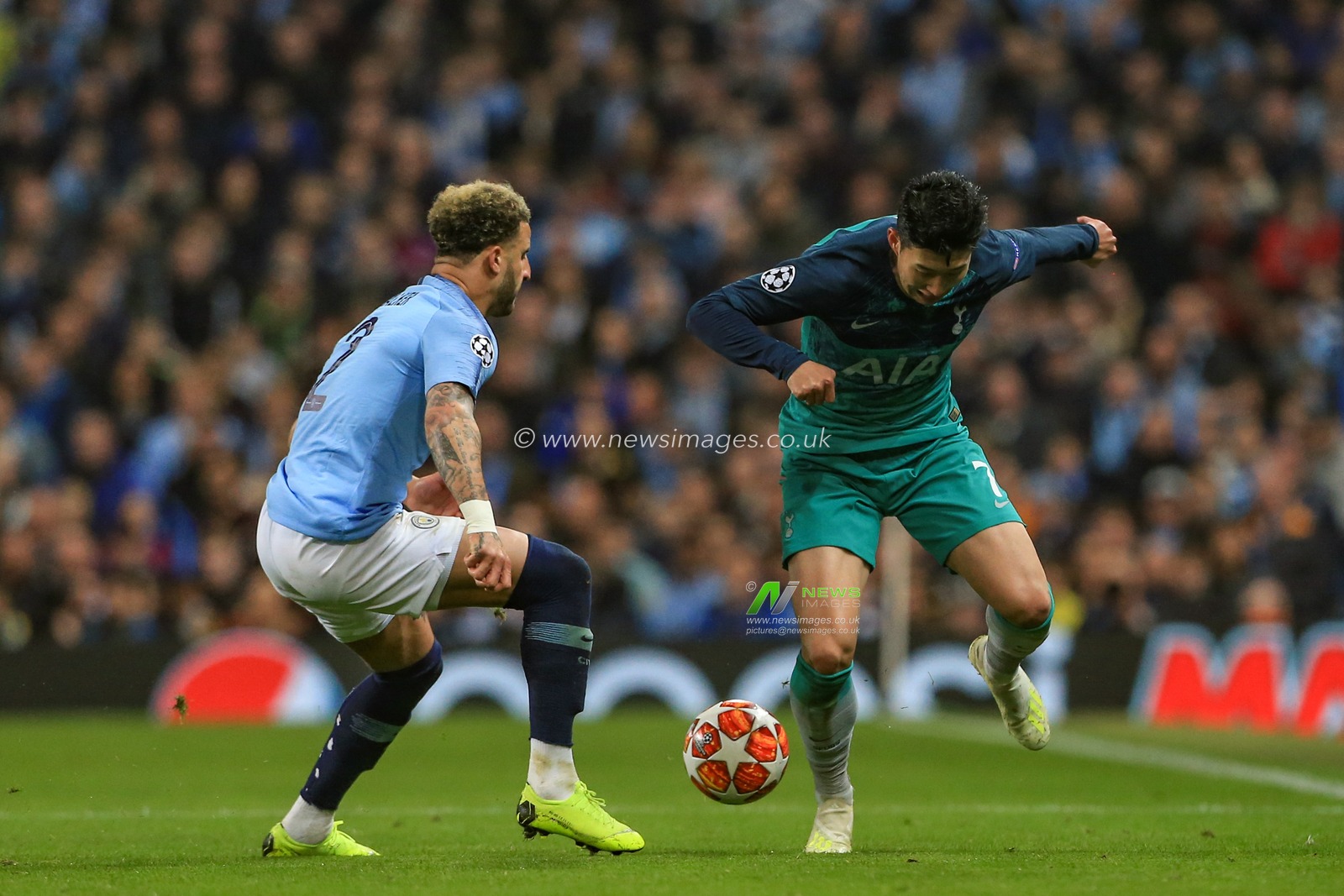 17th April 2019 , Etihad Stadium, Manchester, England; UEFA Champions League, Quarter Final, Second Leg, Manchester City v Tottenham ; Kyle Walker (02) of Manchester City and Son Heung-min (07) of Tottenham dual for the ball 


Credit: Mark Cosgrove/News Images