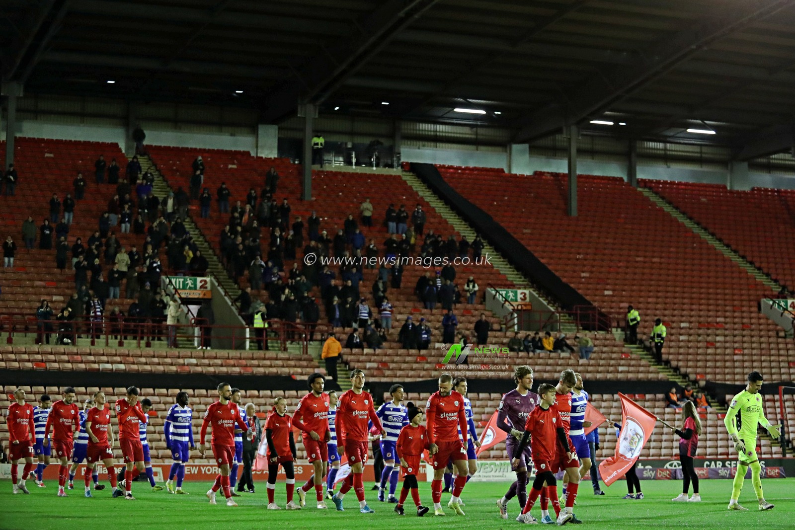 Both teams walk out in front of the Reading fans before the Sky Bet League 1 match Barnsley vs Reading at Oakwell, Barnsley, United Kingdom, 26th November 2024

(Photo by Sam Eaden/News Images)