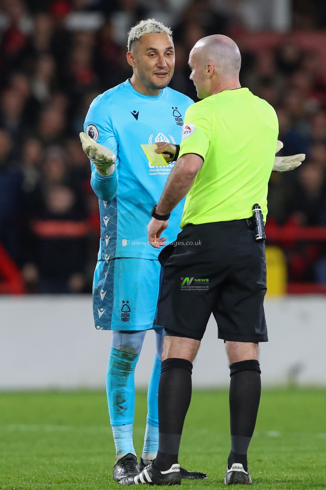 Keylor Navas #12 of Nottingham Forest receives a yellow card from referee Paul Tierney during the Premier League match Nottingham Forest vs Newcastle United at City Ground, Nottingham, United Kingdom, 17th March 2023

(Photo by Gareth Evans/News Images)