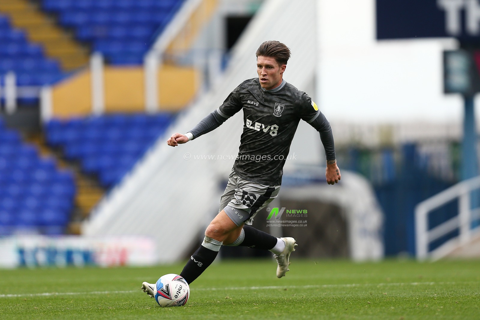 Josh Windass (18) of Sheffield Wednesday dribbles the ball