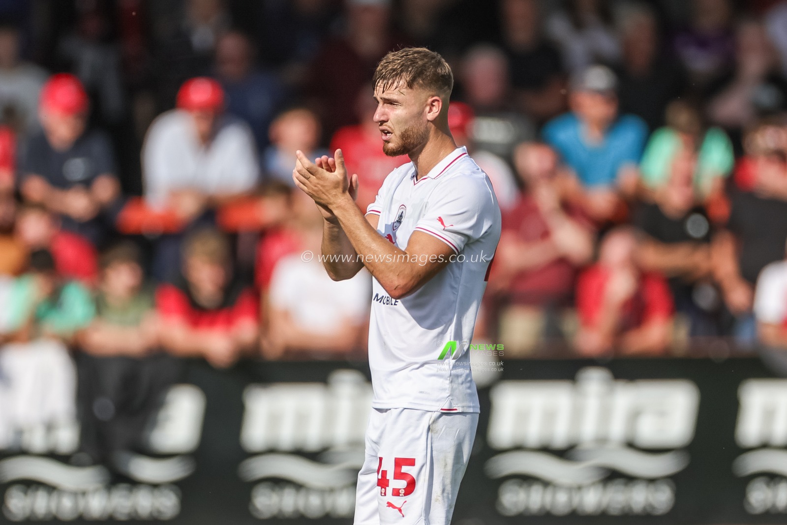 John Mcatee #45 of Barnsley applauds the fans as heâ€™s substituted during the Sky Bet League 1 match Cheltenham Town vs Barnsley at The Jonny-Rocks Stadium, Cheltenham, United Kingdom, 2nd September 2023

(Photo by Mark Cosgrove/News Images)