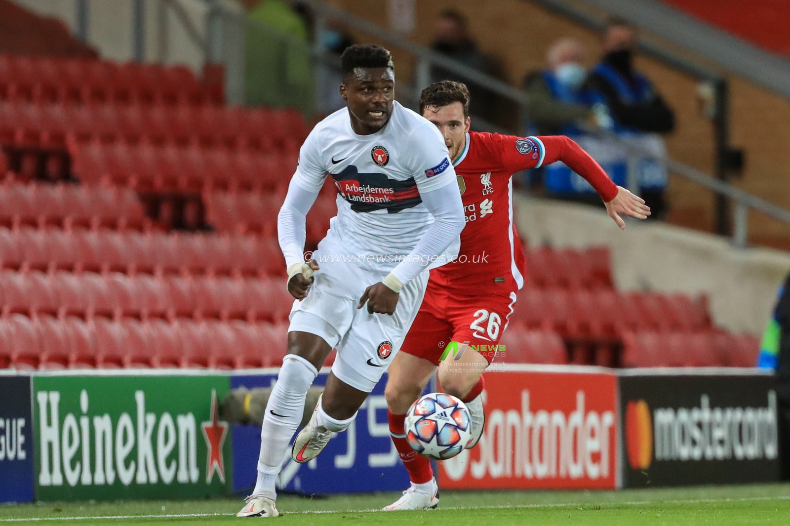 Sory Kaba (9) of FC Midtjylland breaks from Andrew Robertson (26) of Liverpool