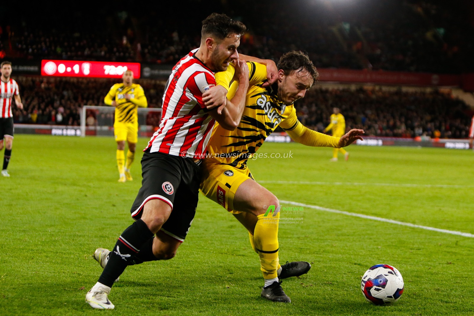 George Baldock #2 of Sheffield United and Ollie Rathbone #18 of Rotherham United during the Sky Bet Championship match Sheffield United vs Rotherham United at Bramall Lane, Sheffield, United Kingdom, 8th November 2022

(Photo by Ben Early/News Images)