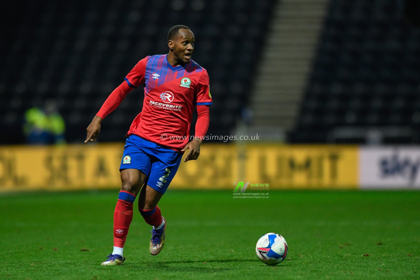 Ryan Nyambe #2 of Blackburn Rovers looks for a pass
