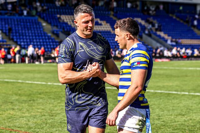 Sam Burgess manager of Warrington shakes hands with Josh Smith of Warrington Wolves as he is named player of the match during the Betfred Super League round 12 match Warrington Wolves vs Bradford Bulls at The Halliwell Jones Stadium, Warrington, United Kingdom on 24 May 2026

(Photo by Alfie Cosgrove/News Images)