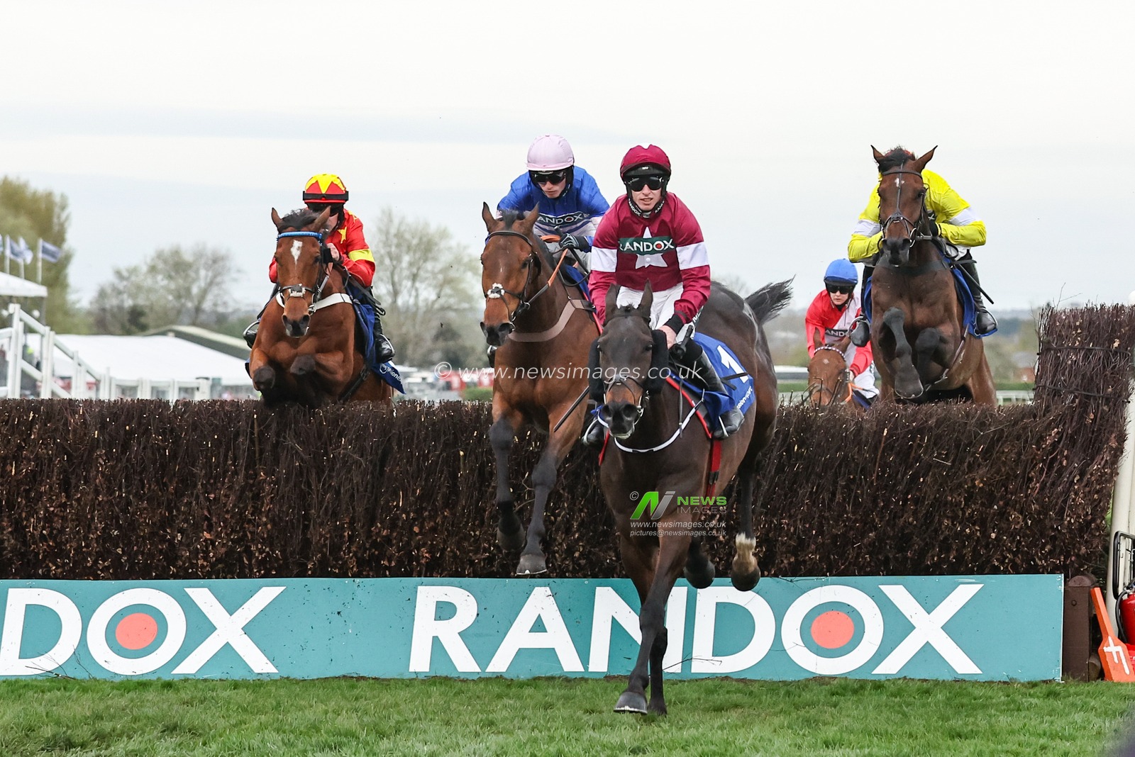 Conflated ridden by Jack Kennedy jumps the fence first in the first lap during the The Randox Grand National 2024 Ladies Day at Aintree Racecourse, Liverpool, United Kingdom, 12th April 2024

(Photo by Mark Cosgrove/News Images)