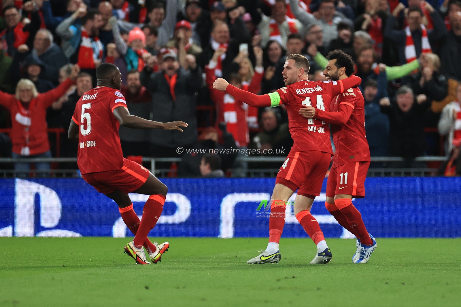 Jordan Henderson #14 of Liverpool celebrates scoring the opening goal with team mates Ibrahima Konate #5 of Liverpool and Mohamed Salah #11 of Liverpool