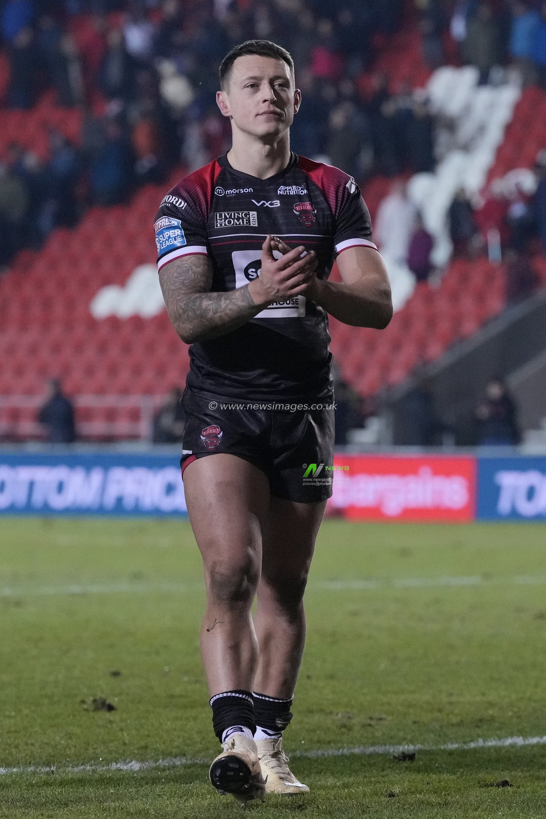 Deon Cross of Salford Red Devils salutes the fans after the Betfred Super League Round 4 match St Helens vs Salford Red Devils at Totally Wicked Stadium, St Helens, United Kingdom, 8th March 2024

(Photo by Steve Flynn/News Images)