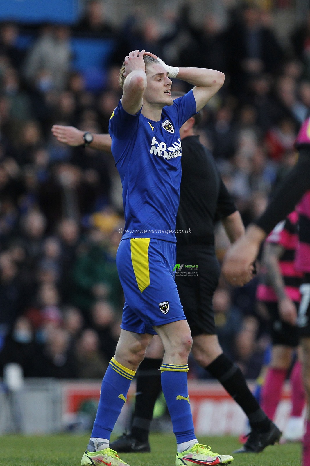 Jack Rudoni #12 of AFC Wimbledon with hands on his head