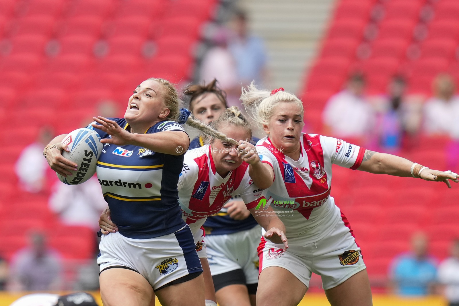 Shona Hoyle #8 of St. Helens tackles Amy Hardcastle #11 of Leeds Rhinos by the hair during the Betfred Challenge Cup match Hull KR vs Leigh Leopards at Wembley Stadium, London, United Kingdom, 12th August 2023

(Photo by Steve Flynn/News Images)