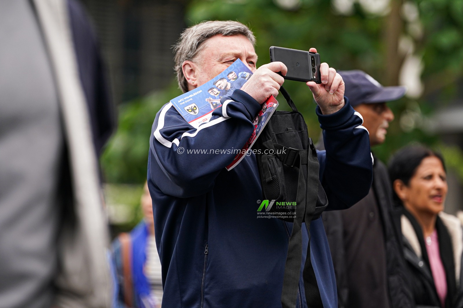 Fan taking photo of Wembley ahead of the Sky Bet League 2 Playoff Final match AFC Wimbledon vs Walsall at Wembley Stadium, London, United Kingdom, 26th May 2025

(Photo by Harvey Murphy/News Images)