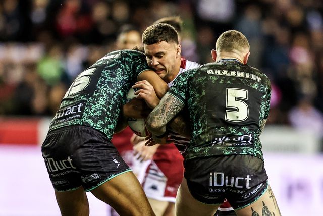 Oliver Partington of Wigan Warriors is tackled by Jacob Alick-Wiencke of Leigh Leopards and Josh Charnley of Leigh Leopards during the Betfred Super League match Wigan Warriors vs Leigh Leopards at The Brick Community Stadium, Wigan, United Kingdom on 26 February 2026

(Photo by Alfie Cosgrove/News Images)